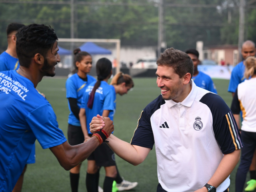 2023_AFKC India Handshake with local coaches during football clinic in India