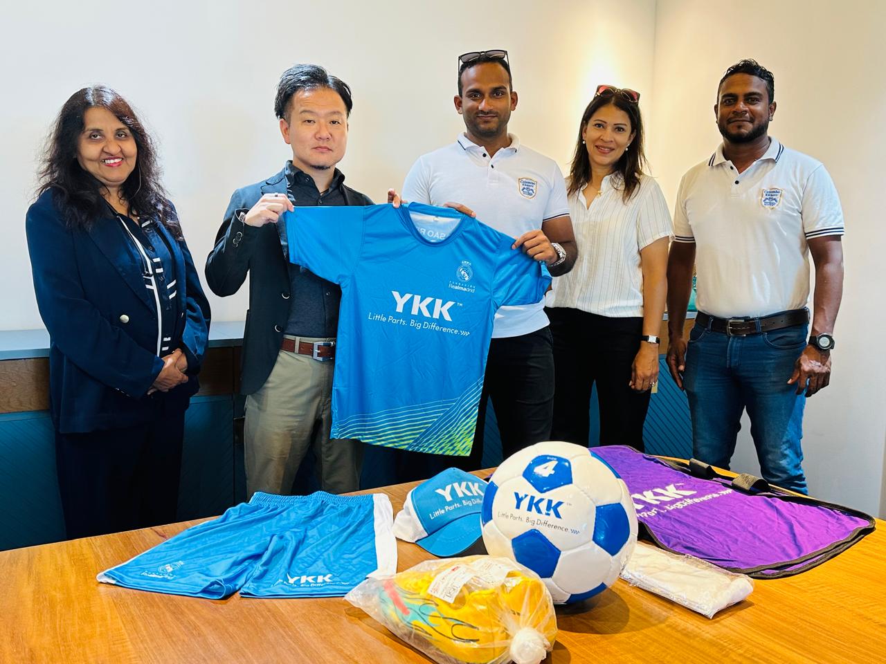 Donation of AKFC merchandise Group photo with merchandise
