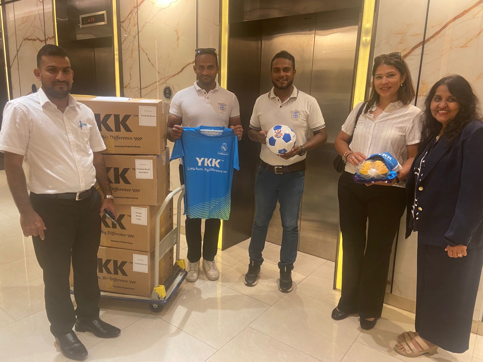 Donation of AKFC merchandise2 Group photo with AKFC 2025 items to donate
